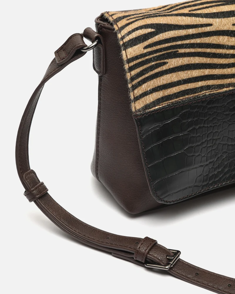 Ziveri bolso bandolera con solapa con estampado patchwork animal print