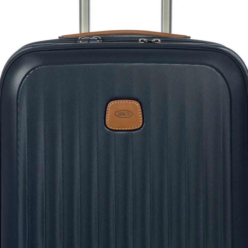 Brics Taormina - Trolley de cabina con 4 ruedas y bolsillo delantero 55 cm expandible USB (blau)