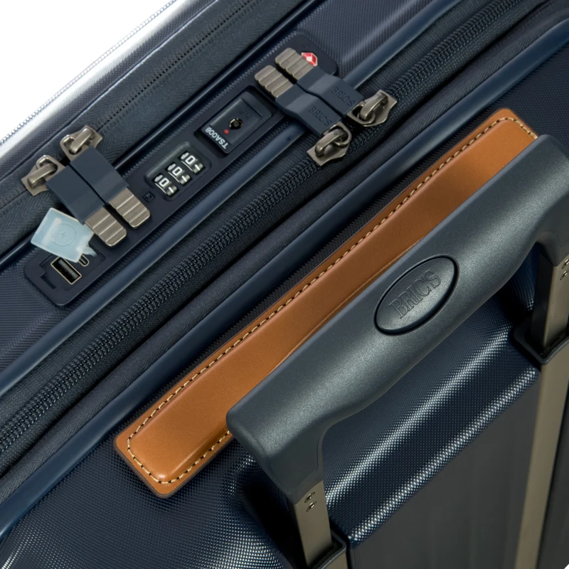 Brics Taormina - Trolley de cabina con 4 ruedas y bolsillo delantero 55 cm expandible USB (blau)